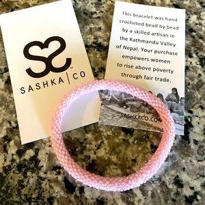 Sashka Co beaded  pink glass bracelet.  Hand crocheted by ladies in Nepal.